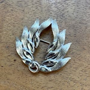 Monet silver tone brooch. Like new condition.